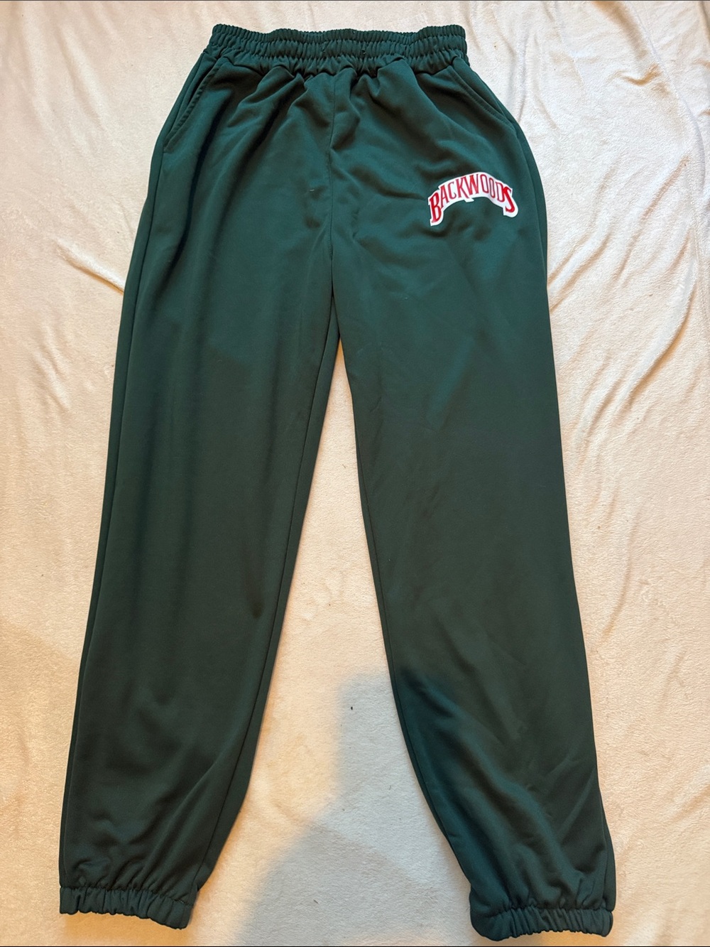 Men’s comfortable green jogger sweatpants with an elastic waist and cuffs.